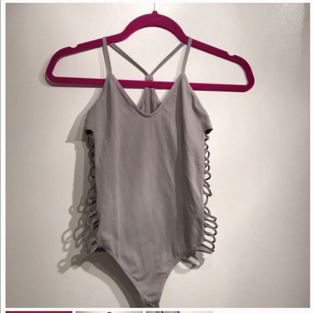 Grey spandex NWOT body suit with caged sides
